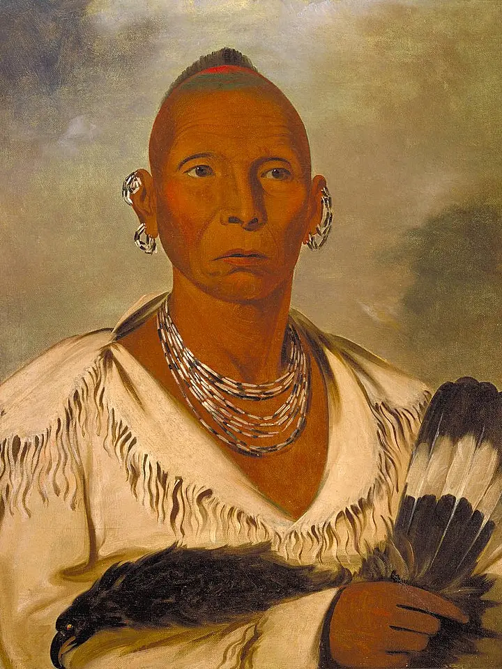 Black Hawk holding a hawk-feather fan