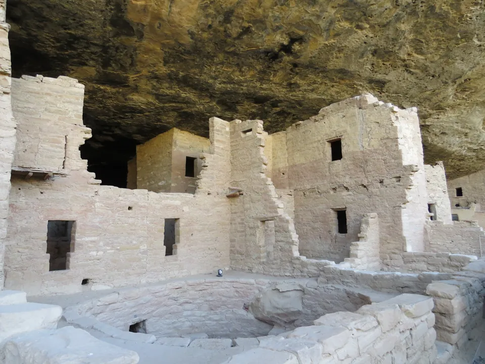 Stone cliff dwellings built under a rock overhang