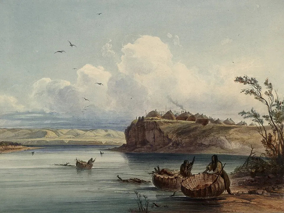 Painting of round bull boats on a river below a village on a bluff