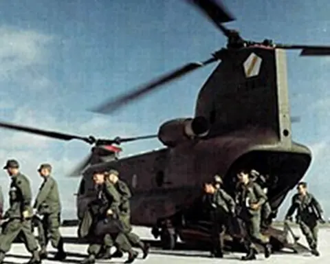 troops deboarding helicopter during the Vietnam War