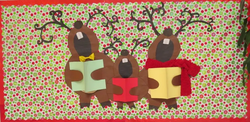 Singing reindeer bulletin board with wrapping paper background