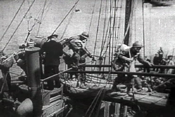 French troops rescued by a British ship at Dunkirk, France 1940).